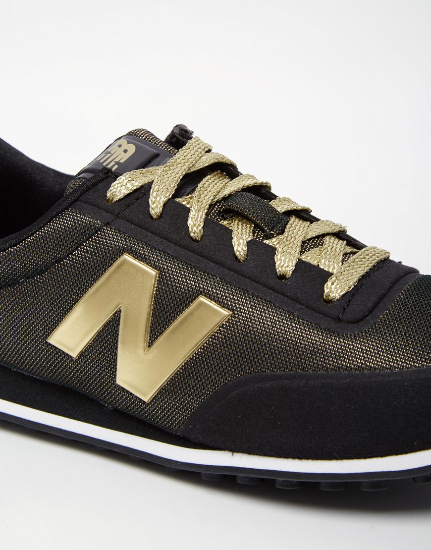 new balance 410 womens black and gold